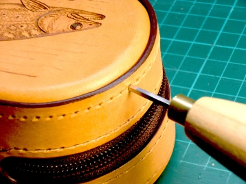 Poking the stitching holes Poking the stitching holes