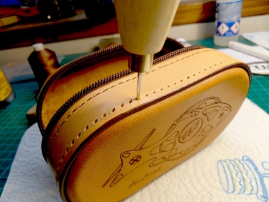 Poking the stitching holes Poking the stitching holes